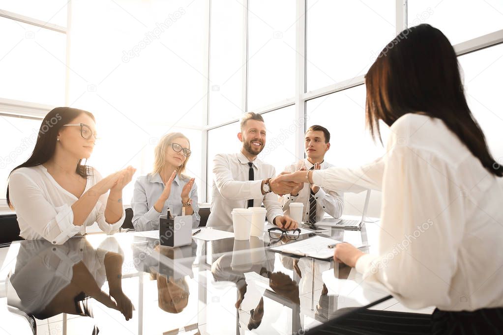 employers congratulate the employee on his promotion