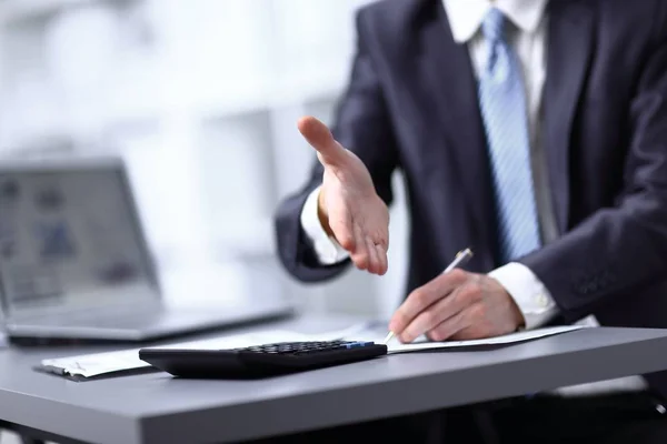 Close-up image of the hand of a business man in a dark suit greeting somebody — Stock Photo, Image