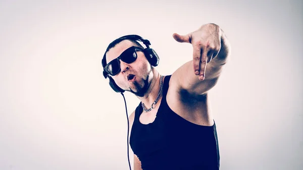 emotional and charismatic DJ - rapper in headphones takes the ra