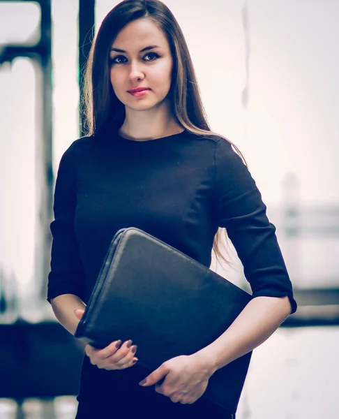 Successful business woman with documents on the background of a — Stock Photo, Image