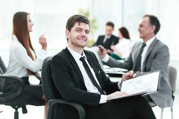 Business man at office with his business team working behind — Stock Photo, Image