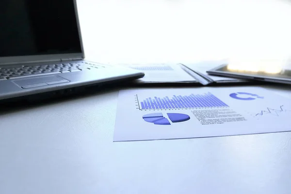 Laptop,digital tablet with financial graph on the desktop — Stock Photo, Image