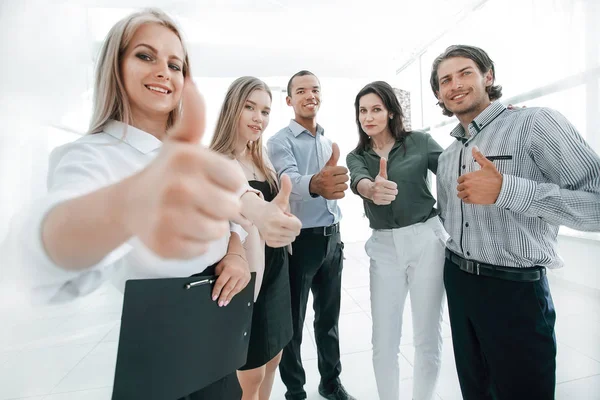 Successful multinational business team showing thumb up — Stock Photo, Image