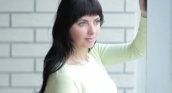 Successful employee standing near the window in the office — Stock Photo, Image