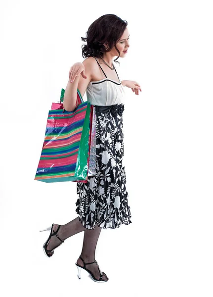 Successful young woman with purchases going forward. — Stock Photo, Image