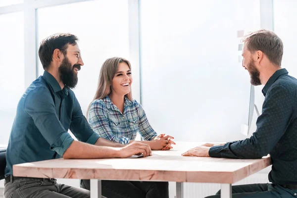 business team discussing current tasks at the desktop.