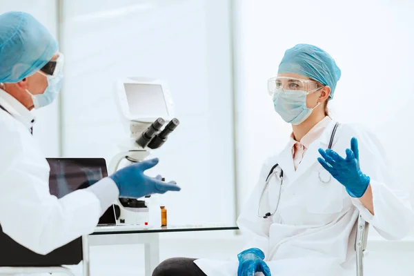Close up. biologists discussing something in the lab. — Stock Photo, Image