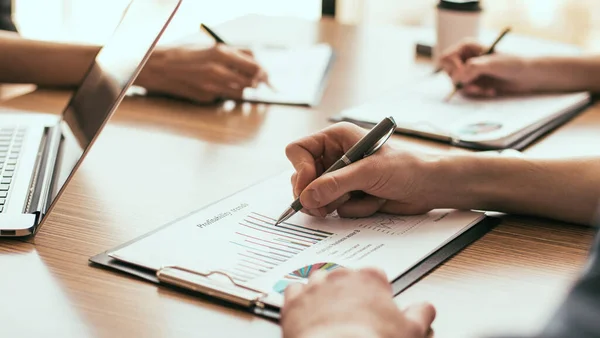 Group of the employees analyzing financial charts — Stock Photo, Image