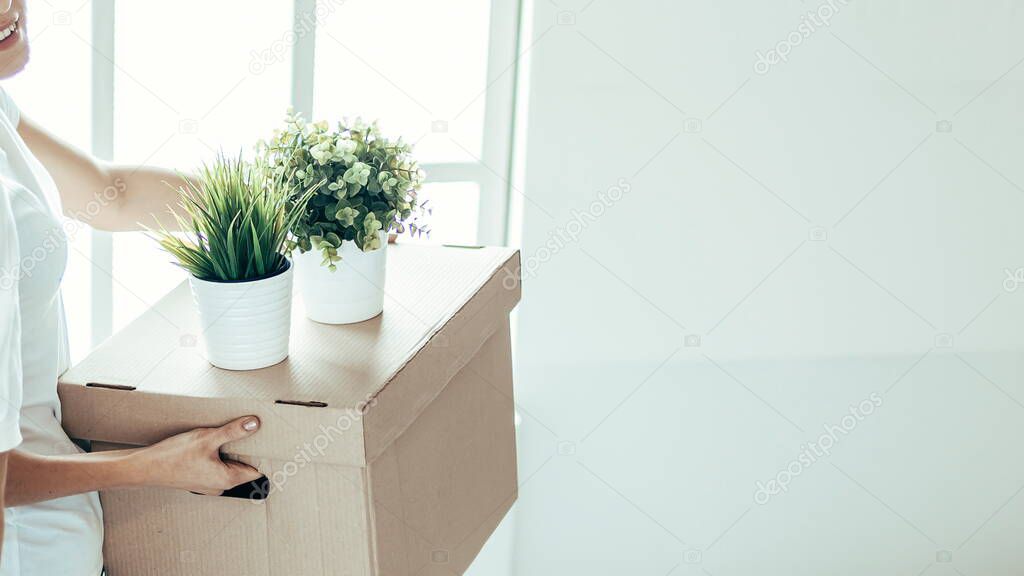 close up. a young couple with boxes in a new apartment.