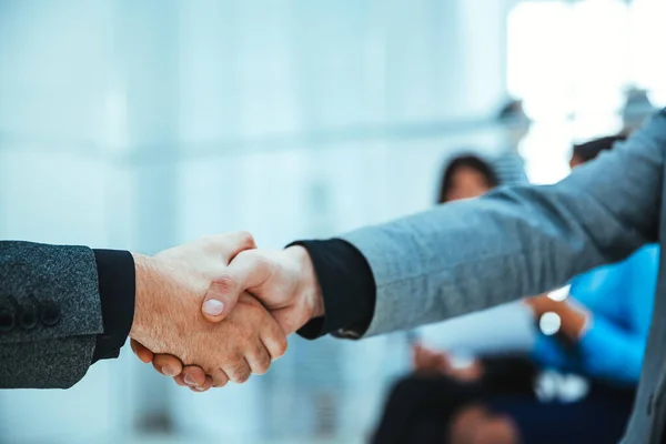 Close up. business handshake on an office background. — Stock Photo, Image