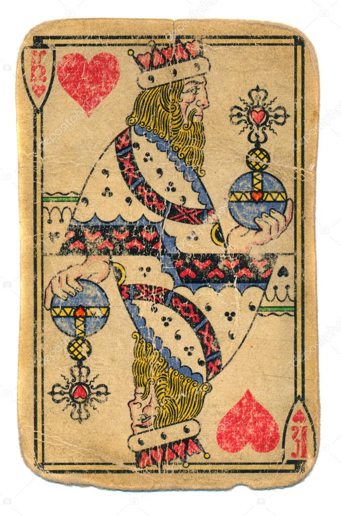 Historical old used king of hearts playing card isolated on white