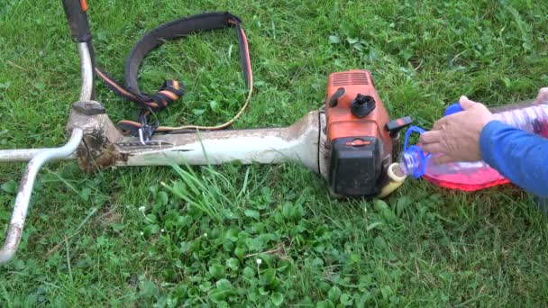 Gardener Pour Fill Gasoline Petrol Lawn Mower Trimmer Tank Garden — Stock Video