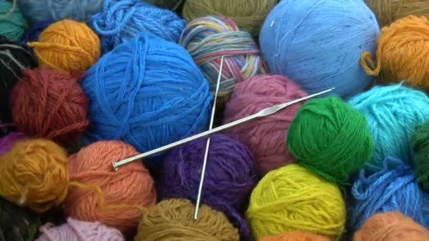 Rotating Many Yarn Wool Balls Two Metal Knitting Crotchets — Stock Video