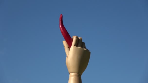 Rotating Art Model Wooden Hand Holding Red Hot Chili Pepper — Stock Video