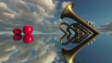 Müzik konsepti. Pirinç rüzgar enstrümanı ve aynada kırmızı elmalar ve bulutlar uzayda hareket ediyor, zaman geçiyor