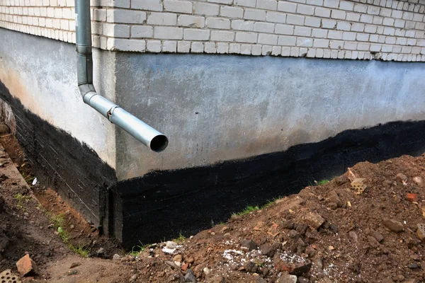 Waterproofing city flat house foundation with bitumen Royalty Free Stock Photos