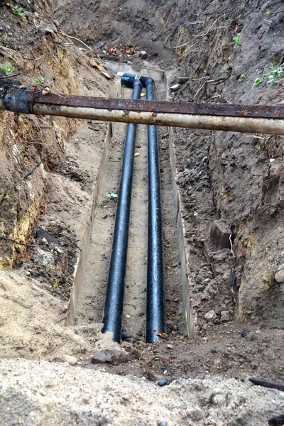 Heating system repair renovation, tube in trench — Stock Photo, Image