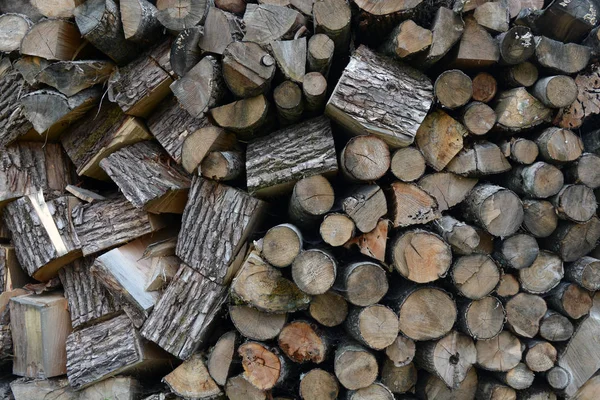 Old firewood outdoor stack background and texture — Stock Photo, Image