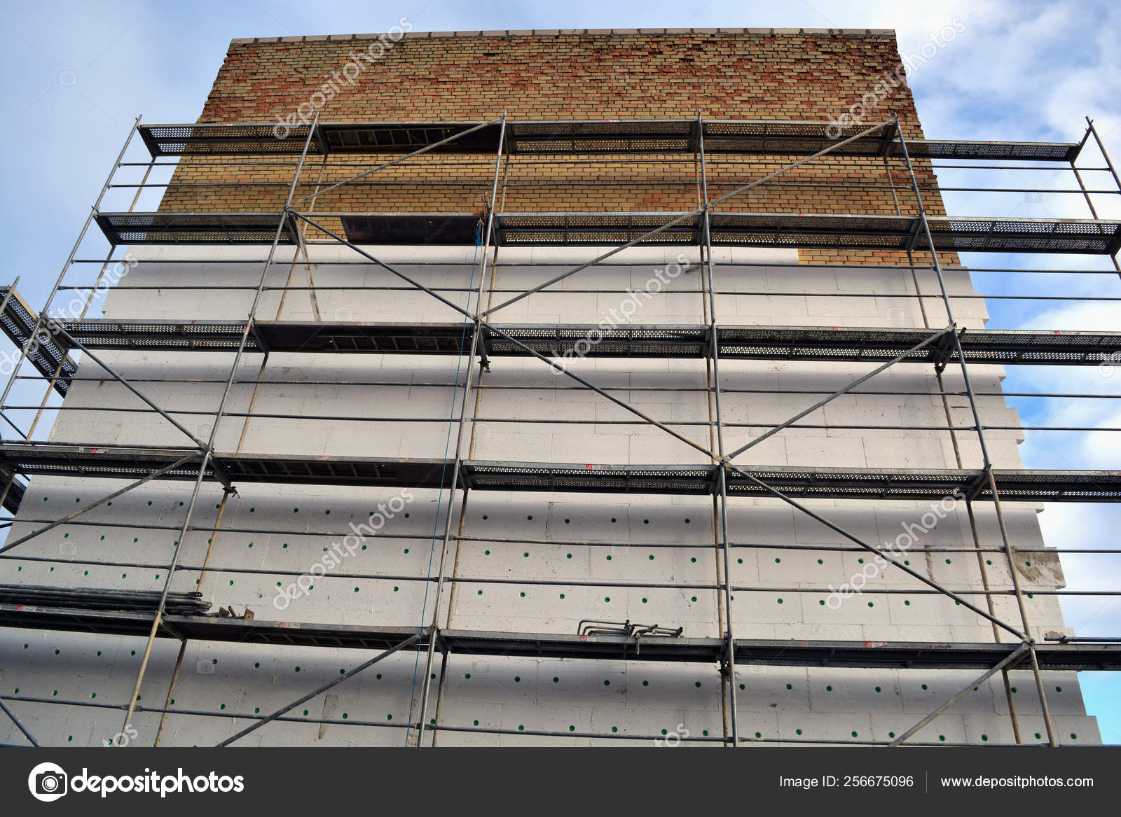 Insulating Old Flat House Brick Wall With White Polystyrene