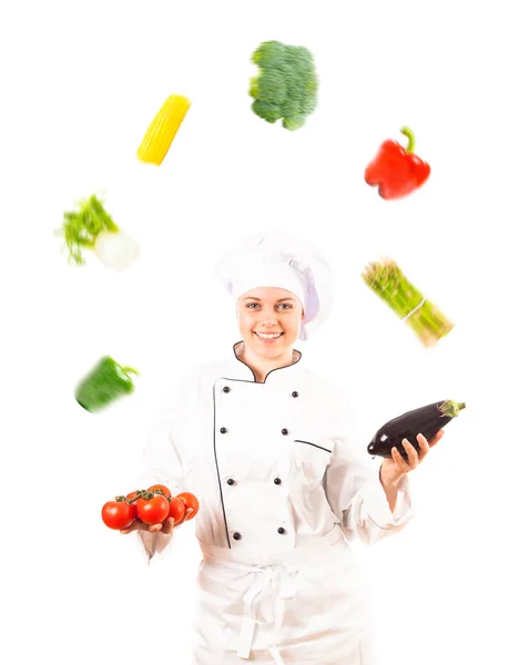 Koch jongliert mit Gemüse — Stockfoto