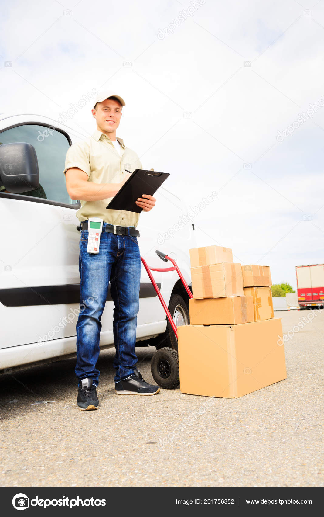 Delivery Boy Standing Next To His Van 
