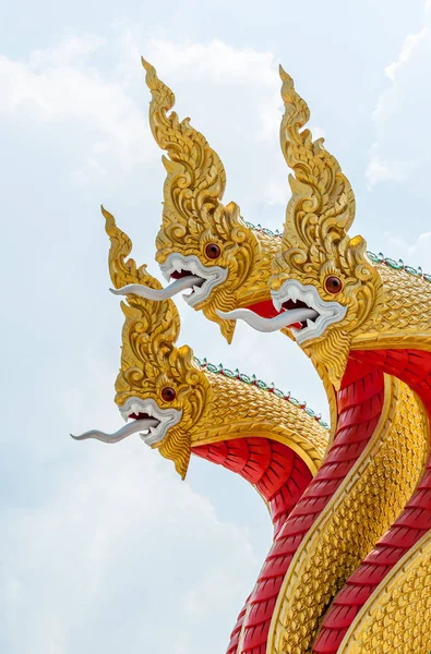 Golden serpent sculpture in the traditional Thai style. — Stock Photo, Image