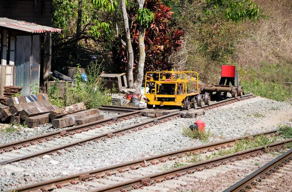 A small inspector car is parking in the local station for maintenance of the railway in the northern line of Thailand.