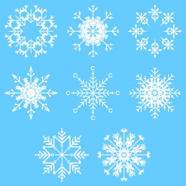 sanatsal buzlu soyut kristal kar taneleri üzerinde mavi arka plan izole topluluğu  