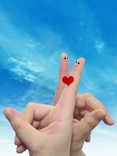 Концепция Женских Рук Двумя Пальцами Окрашенными Красным Сердцем Туманном Голубом — стоковое фото