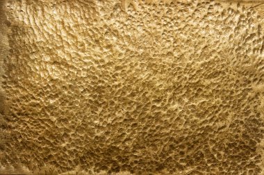 Arka plan olarak altın metal yüzey, altın doku yakın çekim