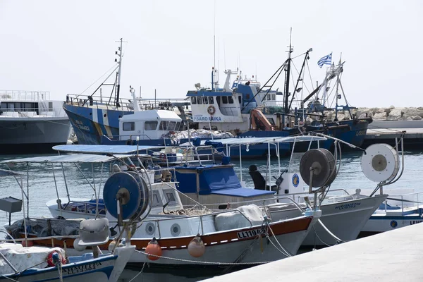 Large sailing boats and yachts on the pier on a clear day