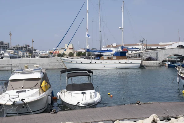 Large sailing boats and yachts on the pier on a clear day