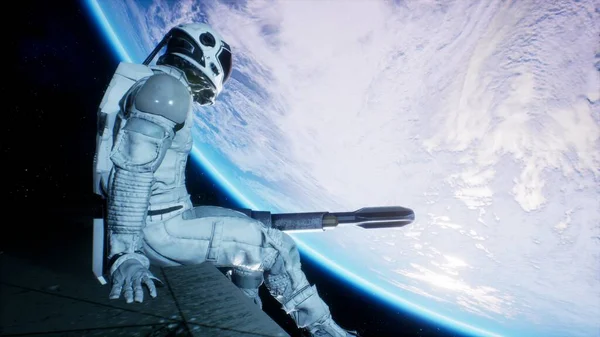 An astronaut sits on the wing of his spaceship and swings his legs looking at the blue planet. 3D Rendering.