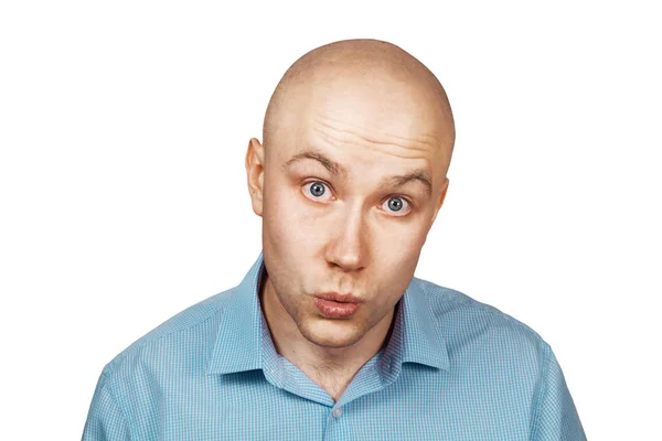 Portrait bald unsure man doesn't understand anything . guy in a blue shirt on white isolated background in perplexity — Stock Photo, Image