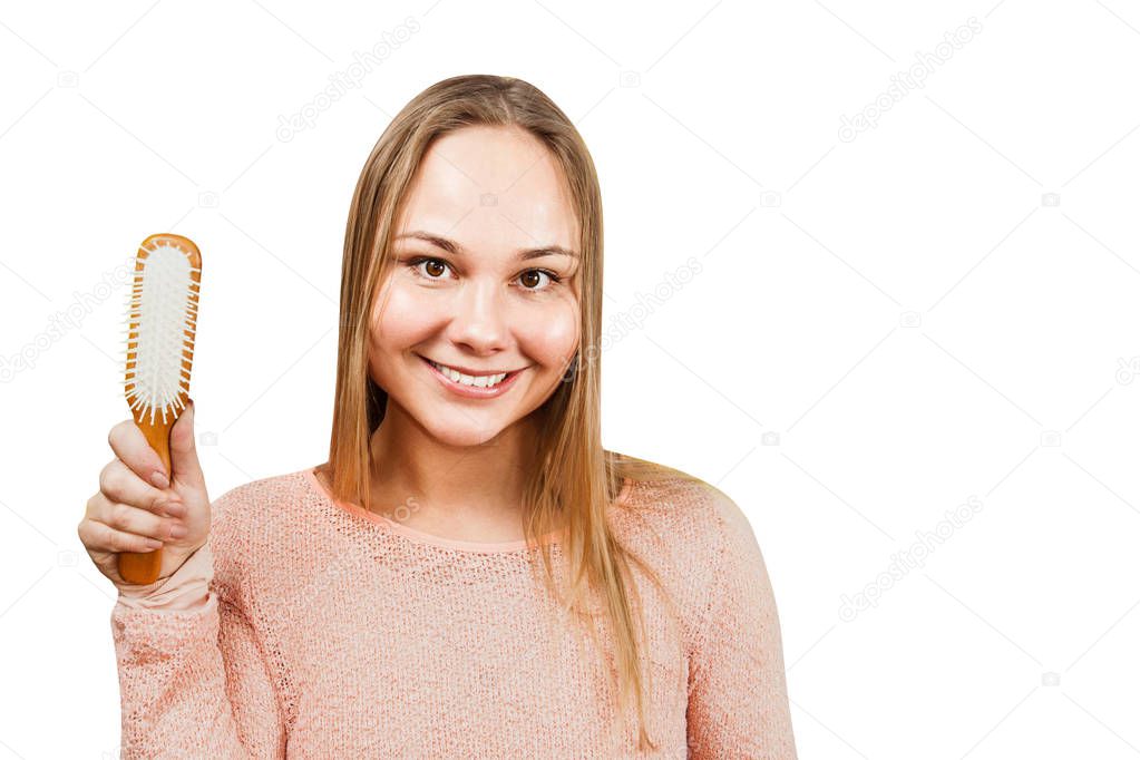 Portrait of a beautiful smiling young woman hold comb, isolated on white background