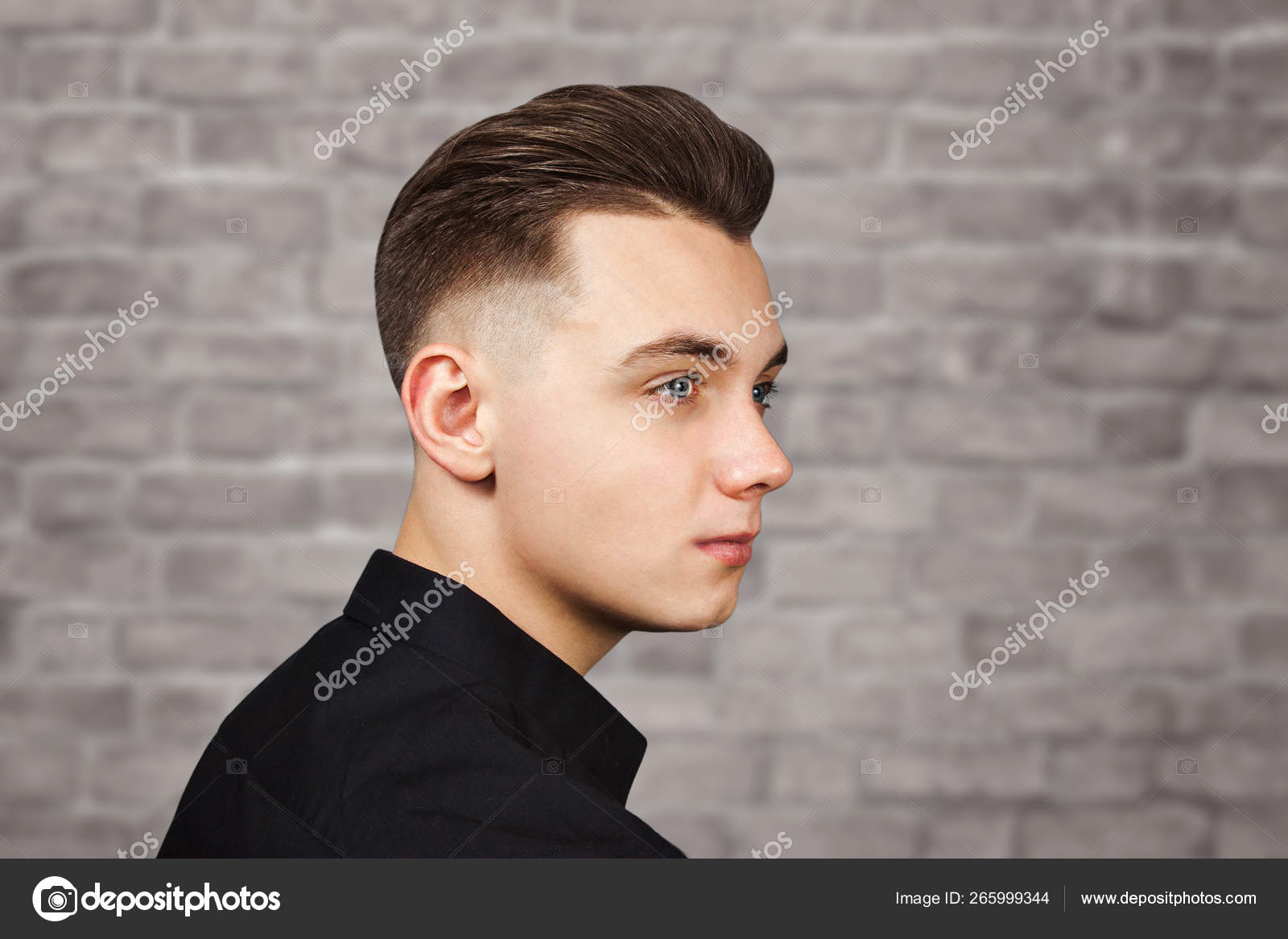 Young White Guy With A Pompadour Hairstyle Dressed In Black Shirt
