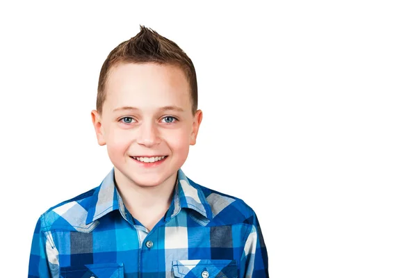 Portrait of a smiling boy dressed in blue shirt, closeup, isolated on white background. — Stock Photo, Image