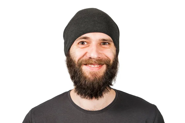 Fiatal szakállas fickó kalapban, mosolyog. Fehér alapon elszigetelve — Stock Fotó