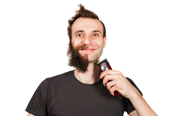 半胡子的男人惊讶地微笑着抱着剪发器。在白色背景上隔离 — 图库照片