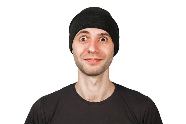 Young funny smiling man with wide eyes in hat isolated on white background — 스톡 사진