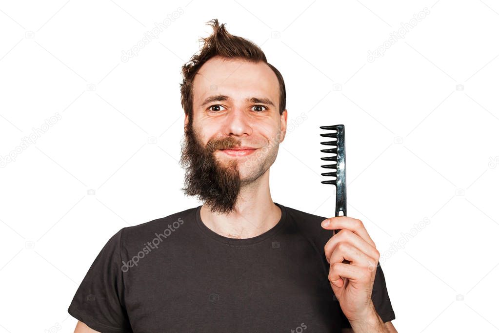Man with half shaved beard surprised with smile hold hair comb. Isolated on white background