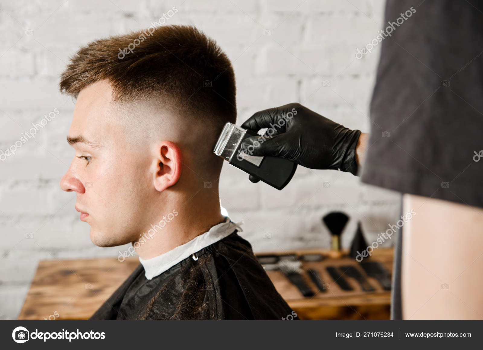 Barber hand in gloves cut hair and shaves young man on a brick wall background. Close up portrait of a guy Stock Photo by ©gum92 271076234 Barber hand in gloves cut hair and shaves young man on a brick wall background. Close up portrait of a guy Stock Photo by ©gum92 271076234