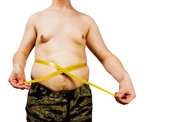 Szerve fiatal férfi a túlsúly, tartsa hasa zsír, az intézkedés maga a mérőszalag. izolált fehér háttér. — Stock Fotó