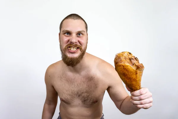 Человек Держит Руке Кусает Огромное Мясо — стоковое фото