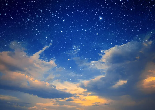 The starry sky and the blue sky together. Sunset. Night sky with stars and  clouds. Sunrise