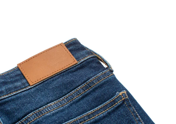 Blank leather jeans label sewed on a jeans. Close up of a jeans label. — Stock Photo, Image