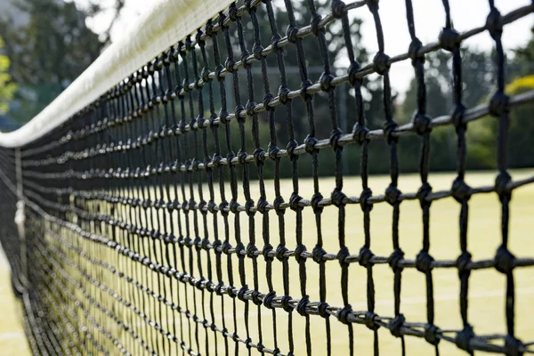 black net on a tennis court