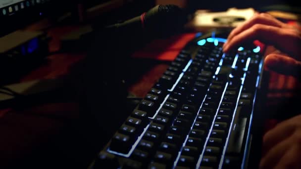 Man Speaking Microphone While Typing Illuminated Keyboard — Stock Video