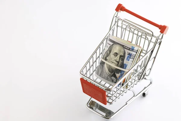 Dolarů v supermarketu košík — Stock fotografie