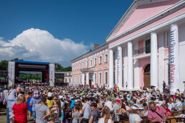 Tulchin, Ukraine. 9 June, 2018. The audience of the festival.Palace of Count Potocki during the Operafest-Tulchyn 2018 Open Air Opera Festival. clipart